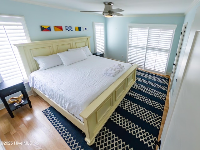 109 Island Quay Ct, Atlantic Beach, NC 28512 - bedroom with crown molding, light wood-style floors, and ceiling fan