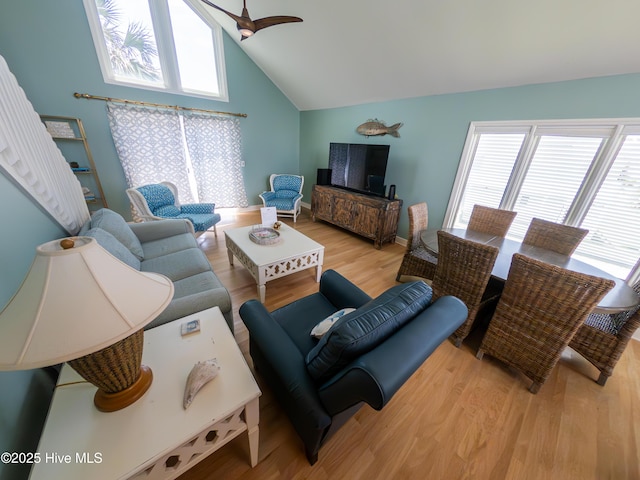 109 Island Quay Ct, Atlantic Beach, NC 28512 - living room featuring vaulted ceiling, healthy amount of natural light, wood finished floors, a ceiling fan, and baseboards