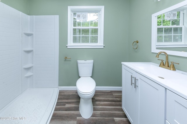 190 NC Highway 32, Sunbury, NC 27979 - full bath featuring baseboards, toilet, wood finished floors, vanity, and a tile shower