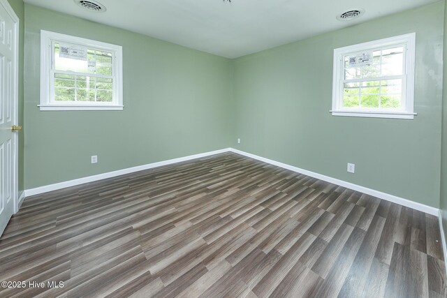 190 NC Highway 32, Sunbury, NC 27979 - unfurnished room with dark wood-style flooring and baseboards