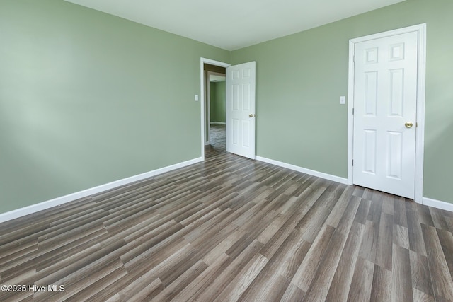 190 NC Highway 32, Sunbury, NC 27979 - unfurnished bedroom featuring dark wood-style floors and baseboards