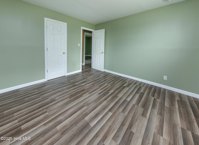 190 NC Highway 32, Sunbury, NC 27979 - unfurnished bedroom featuring baseboards and dark wood-style floors