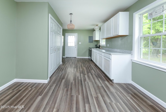 190 NC Highway 32, Sunbury, NC 27979 - kitchen with baseboards, white cabinets, and dark wood-style floors