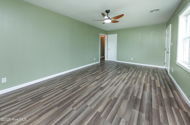 190 NC Highway 32, Sunbury, NC 27979 - empty room with dark wood-type flooring, a ceiling fan, and baseboards