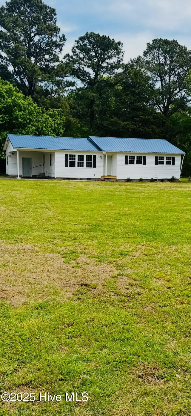 190 NC Highway 32, Sunbury, NC 27979 - view of front of house featuring a front yard and metal roof