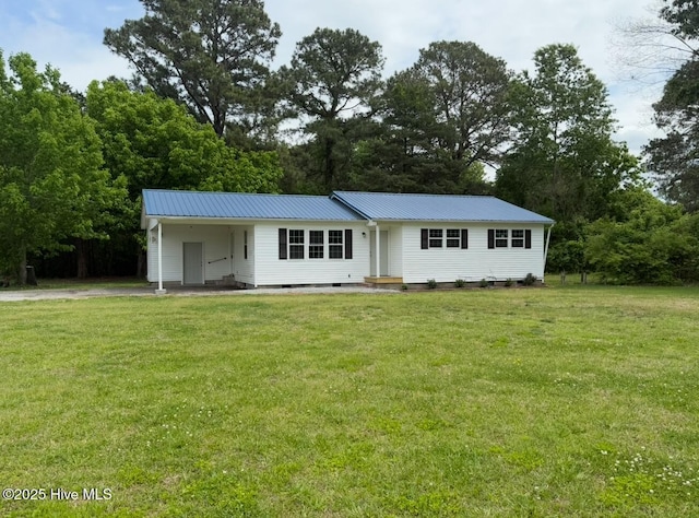 190 NC Highway 32, Sunbury, NC 27979 - view of front of home with driveway, a front lawn, an attached carport, and metal roof