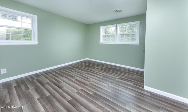 190 NC Highway 32, Sunbury, NC 27979 - unfurnished room featuring baseboards and dark wood-style flooring