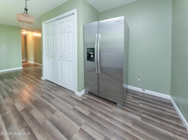 190 NC Highway 32, Sunbury, NC 27979 - kitchen featuring stainless steel fridge with ice dispenser, wood finished floors, and baseboards
