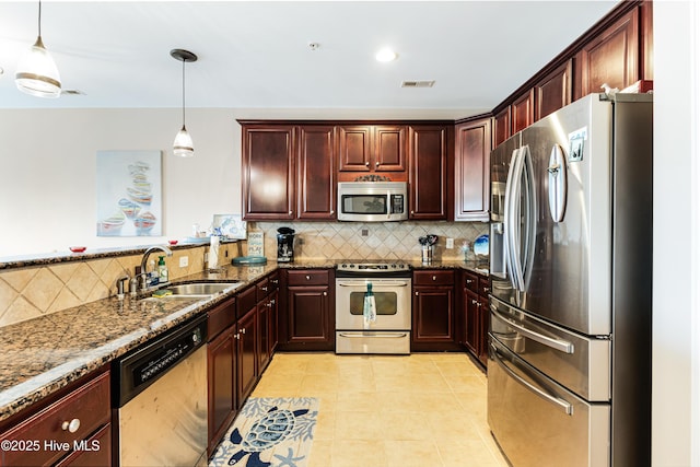120 SE 58th St Unit 2104, Oak Island, NC 28465 - kitchen with dark stone counters, backsplash, stainless steel appliances, and visible vents