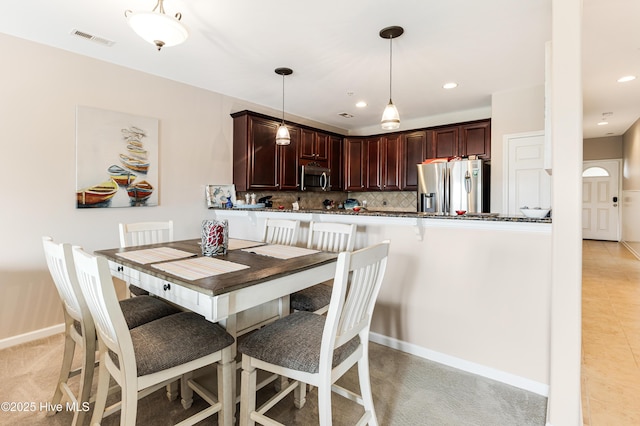 120 SE 58th St Unit 2104, Oak Island, NC 28465 - dining room with recessed lighting, baseboards, and visible vents