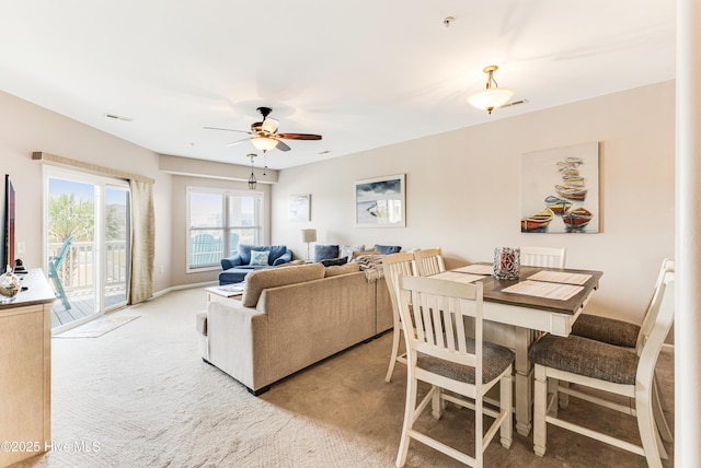 120 SE 58th St Unit 2104, Oak Island, NC 28465 - living area with a ceiling fan, visible vents, and light carpet
