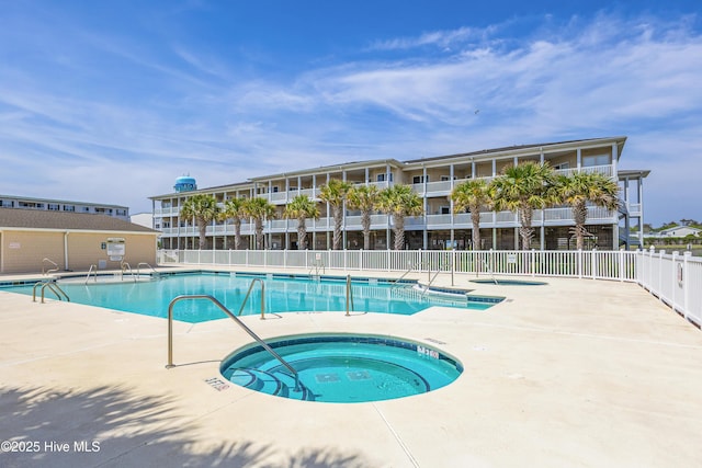 120 SE 58th St Unit 2104, Oak Island, NC 28465 - pool with a hot tub, fence, and a patio area