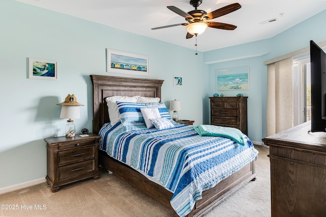 120 SE 58th St Unit 2104, Oak Island, NC 28465 - bedroom featuring baseboards, ceiling fan, light carpet, and visible vents