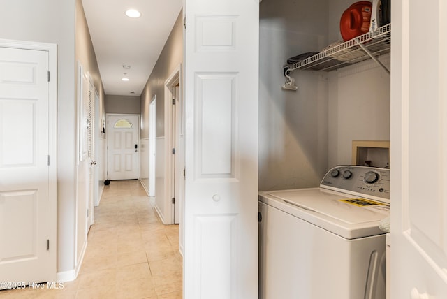 120 SE 58th St Unit 2104, Oak Island, NC 28465 - washroom with recessed lighting, laundry area, washer / dryer, and light tile patterned floors