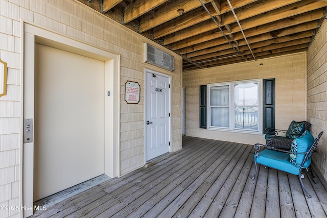120 SE 58th St Unit 2104, Oak Island, NC 28465 - wooden terrace with elevator