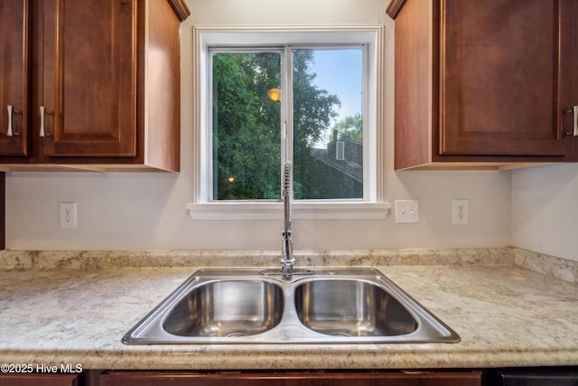 kitchen with a sink and light countertops