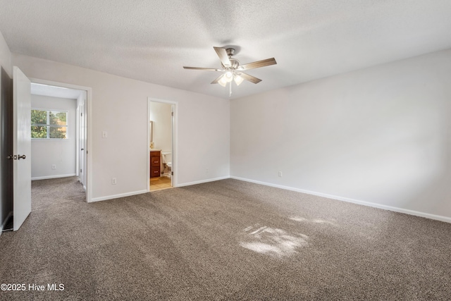 unfurnished room featuring baseboards, a textured ceiling, ceiling fan, and carpet