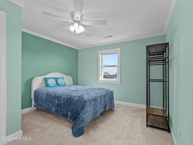 carpeted bedroom featuring crown molding, visible vents, and baseboards