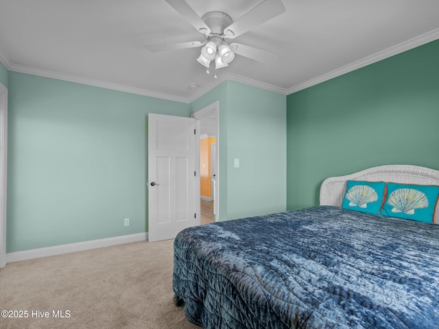 carpeted bedroom featuring ornamental molding, ceiling fan, and baseboards