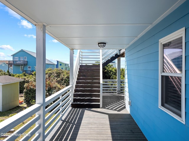 balcony featuring stairs