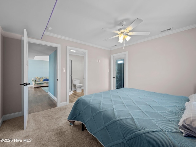 carpeted bedroom with crown molding, a ceiling fan, visible vents, and baseboards