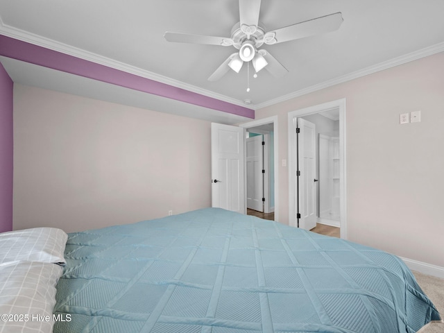 bedroom featuring connected bathroom, crown molding, a ceiling fan, carpet, and baseboards
