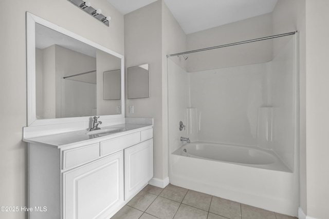 2807 Bloomfield Ln Unit 307, Wilmington, NC 28412 - bathroom with vanity, baseboards, tile patterned floors, and bathtub / shower combination