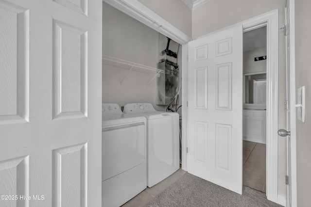 2807 Bloomfield Ln Unit 307, Wilmington, NC 28412 - laundry room with laundry area, washing machine and dryer, and light tile patterned floors