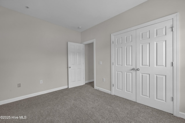 2807 Bloomfield Ln Unit 307, Wilmington, NC 28412 - unfurnished bedroom with baseboards, carpet, and a closet