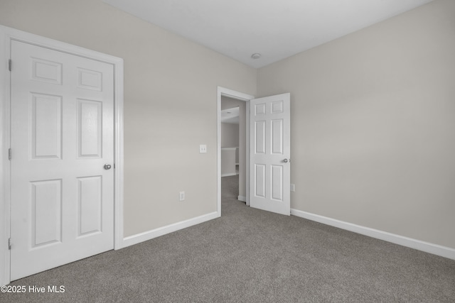 2807 Bloomfield Ln Unit 307, Wilmington, NC 28412 - unfurnished bedroom featuring carpet flooring and baseboards