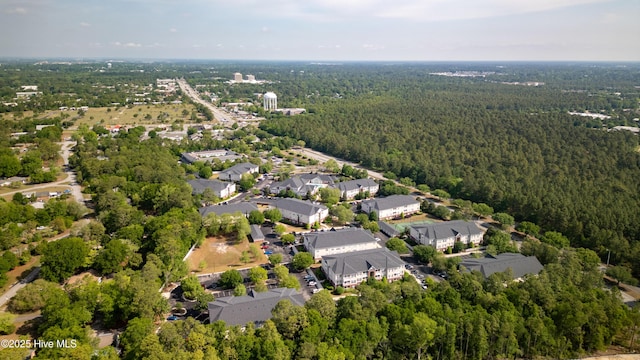 drone / aerial view with a residential view and a forest view