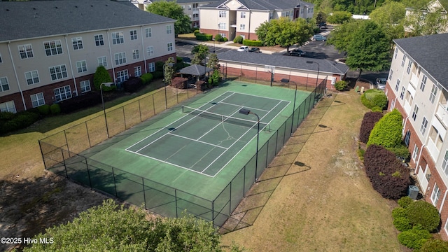view of sport court with fence
