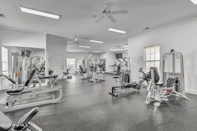 gym featuring crown molding, a ceiling fan, baseboards, and visible vents