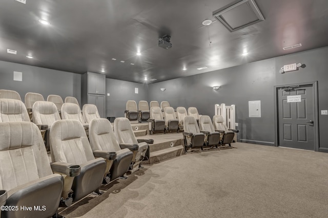 carpeted home theater with baseboards