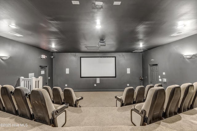 carpeted cinema room featuring visible vents