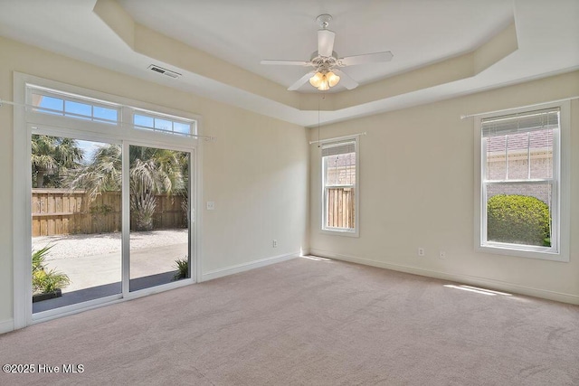 1008 Garden Club Way, Leland, NC 28451 - unfurnished room with a raised ceiling, carpet flooring, baseboards, and a ceiling fan