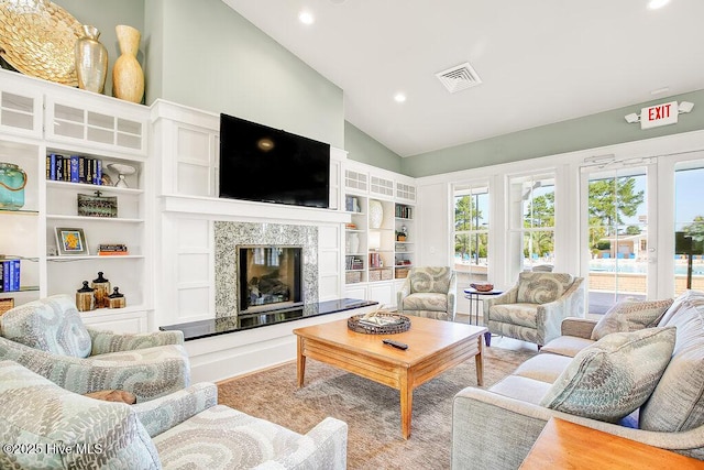 1008 Garden Club Way, Leland, NC 28451 - living area with vaulted ceiling, recessed lighting, a high end fireplace, and built in features