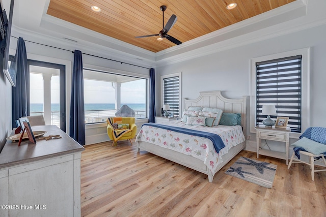 bedroom with recessed lighting, wood ceiling, light wood-style floors, crown molding, and a tray ceiling