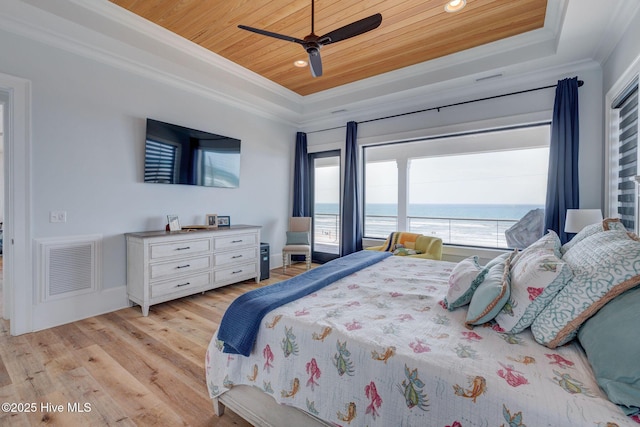 bedroom with wooden ceiling, a tray ceiling, visible vents, light wood-style flooring, and ornamental molding