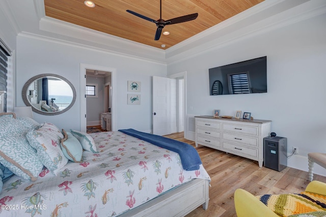 bedroom with recessed lighting, a tray ceiling, crown molding, light wood-style flooring, and wood ceiling
