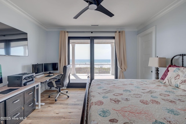 bedroom with light wood-style floors, crown molding, access to outside, and multiple windows