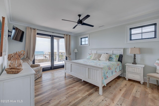 bedroom with crown molding, visible vents, light wood finished floors, a ceiling fan, and access to outside