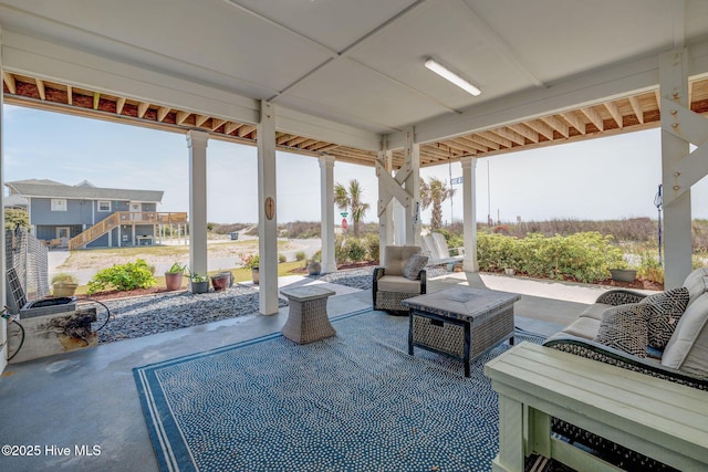 view of patio with outdoor lounge area and stairway