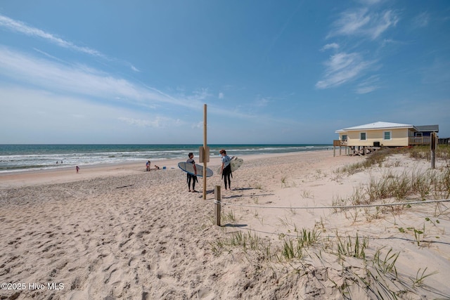 property view of water featuring a beach view