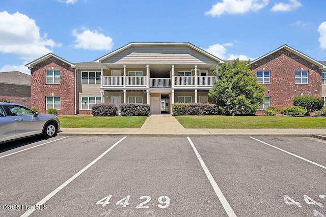 view of property with uncovered parking