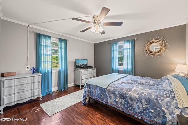 bedroom featuring crown molding, ceiling fan, wood finished floors, and baseboards