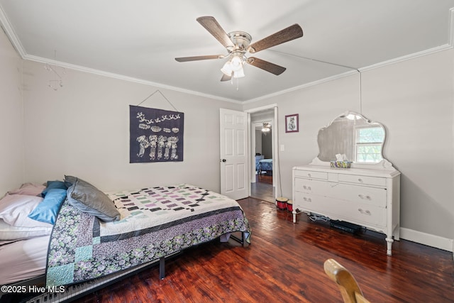 bedroom featuring ornamental molding, a ceiling fan, attic access, and wood finished floors