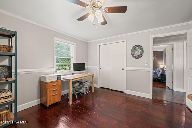 office area with dark wood-type flooring, crown molding, a ceiling fan, and baseboards
