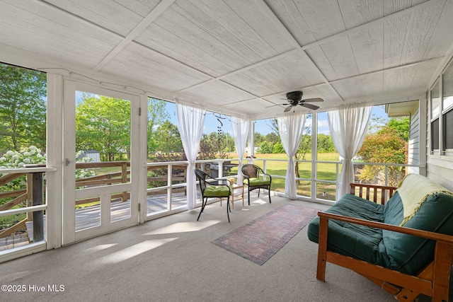 sunroom with a wealth of natural light and ceiling fan