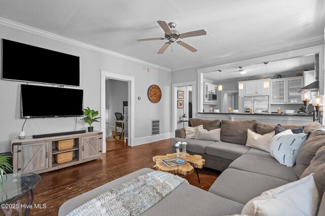 210 S 17th St, Wilmington, NC 28401 - living room featuring ceiling fan, dark wood-style flooring, baseboards, and crown molding